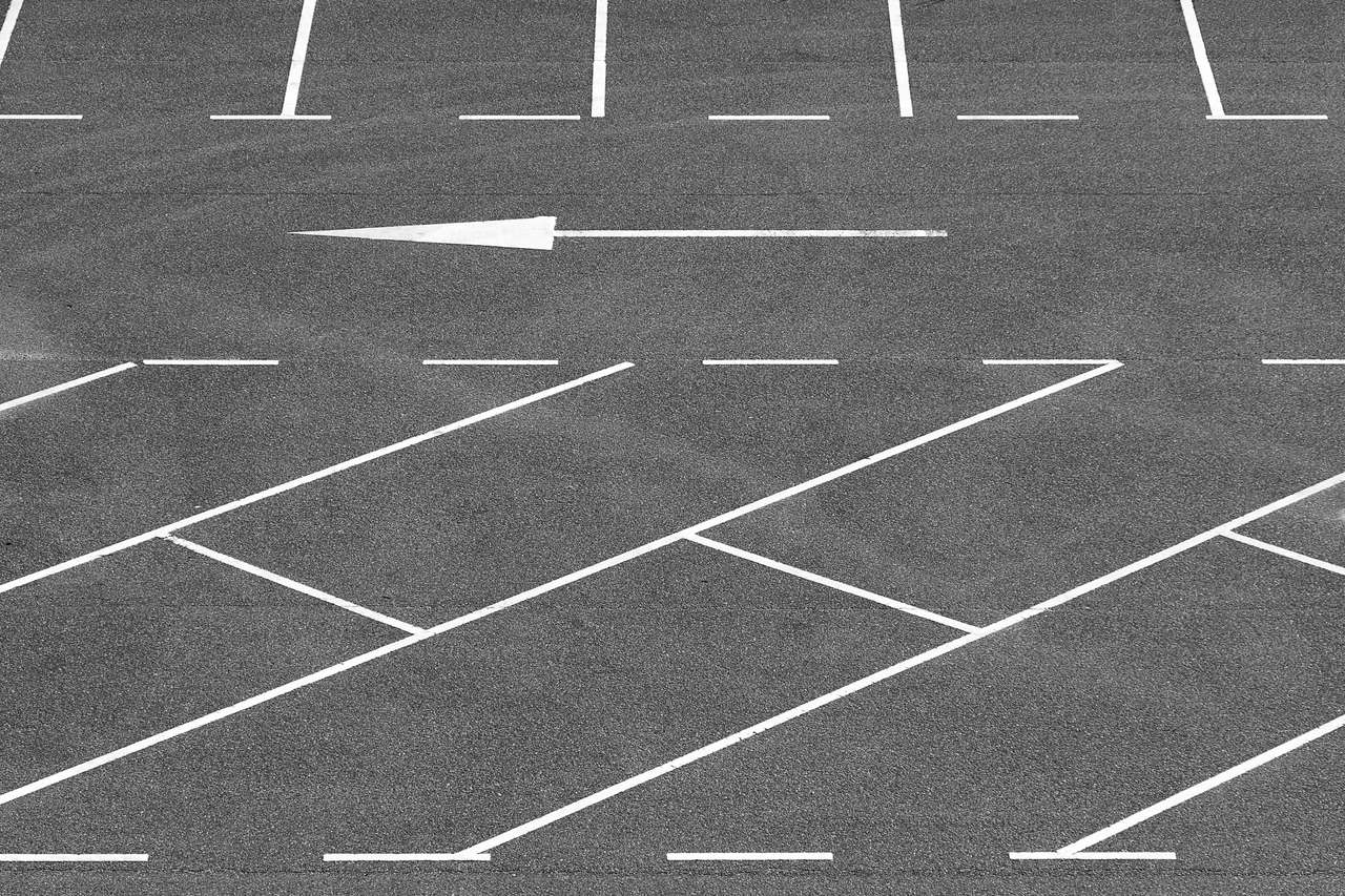 Overhead view of a well maintained parking lot with crisp white stall lines